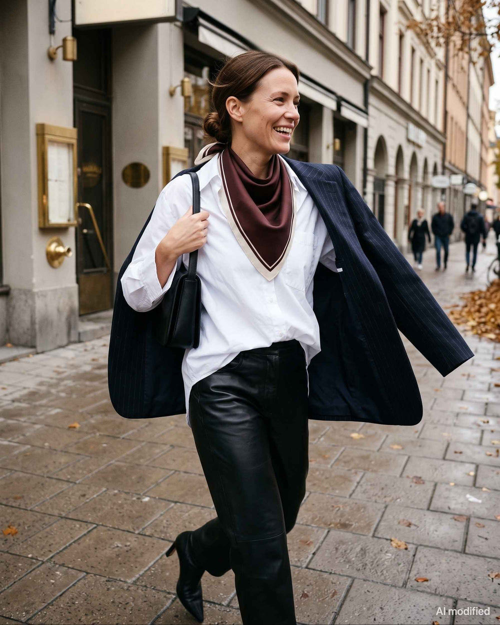 White shirt, pinstriped blazer, leather trousers and scarf